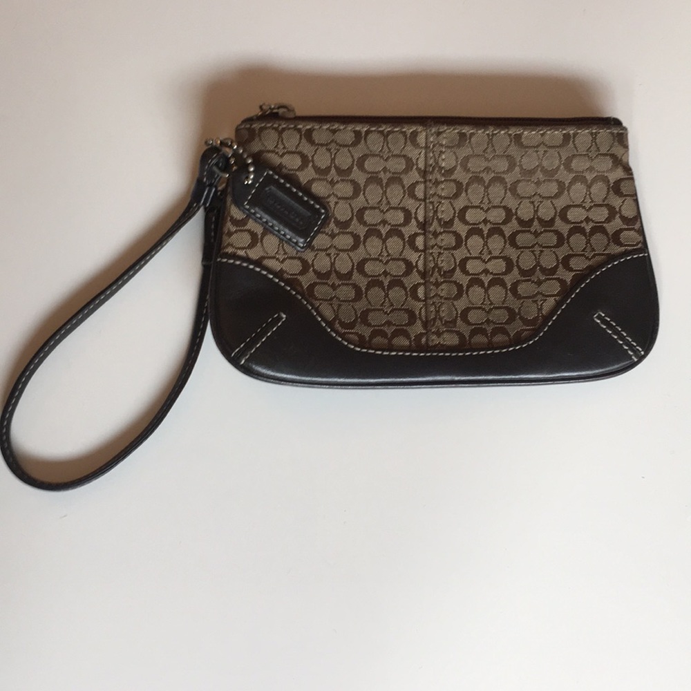 Coach wristlet. Brown signature C